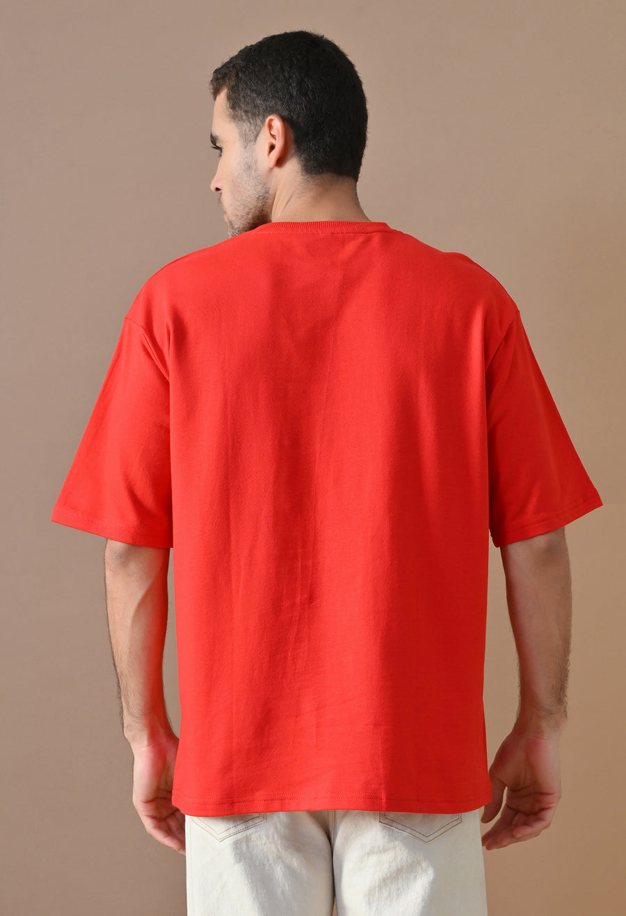 Man wearing OUTSYN Crimson Red Essentials Oversized Heavyweight Tee, back view