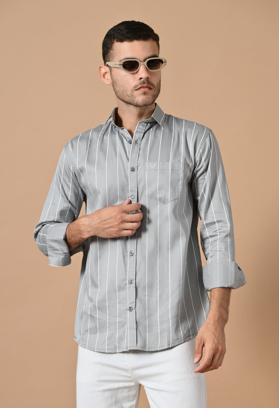 Man wearing the Premium Grey Line Shirt with white trousers