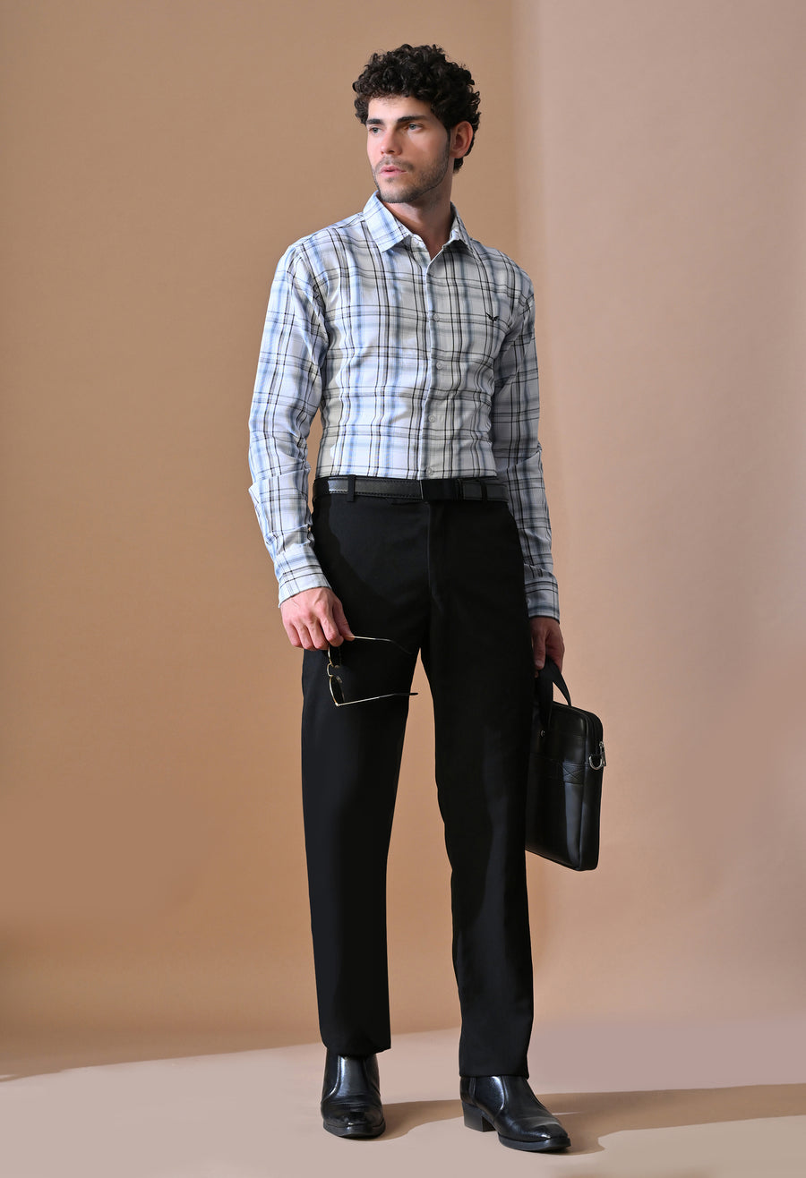 Man wearing OUTSYN Classic Blue & Grey Plaid Button-Up Shirt with black trousers
