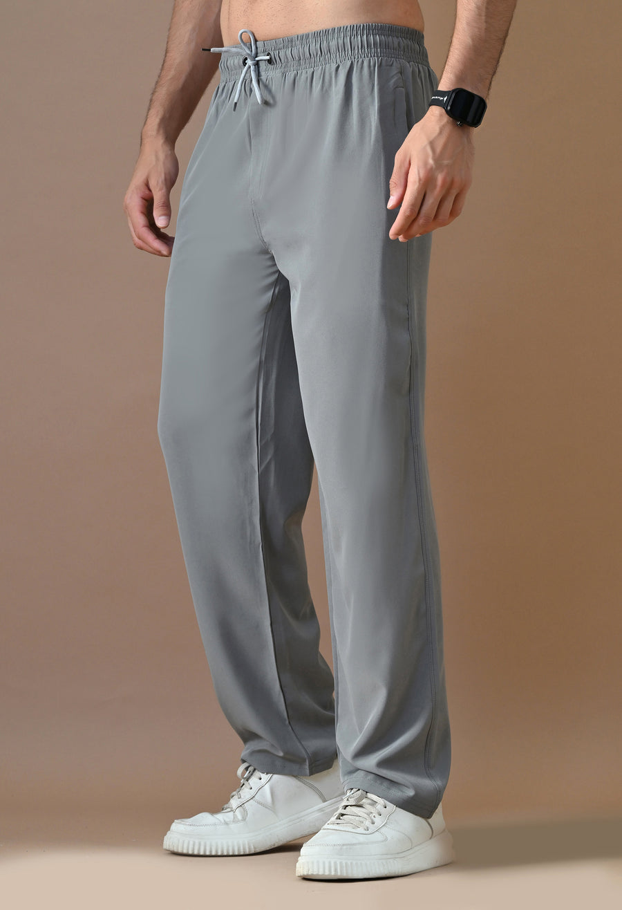 Close-up of grey relaxed-fit drawstring trousers on a man